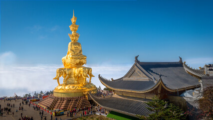  The temple and Buddha at the Golden summit of Mount Emei above the clouds , Sichuan, China.