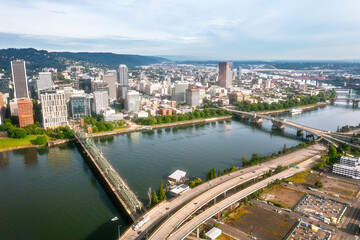 Fototapeta premium Various day and sunset drone scene of Portland Oregon, Willamette river and downtown, Aerial drone footage