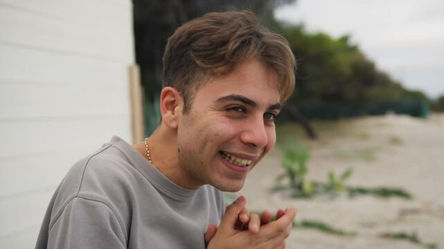 Boy Smiles Mischievously While Hatching a Diabolical Plan Outside