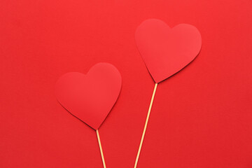 Red paper hearts on color background. Valentine's Day celebration