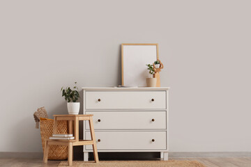Interior of room with white commode, stool and plants