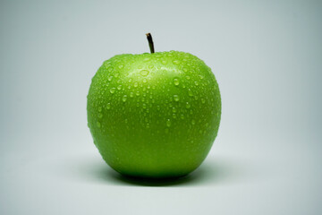 granny smith apple droplets with water