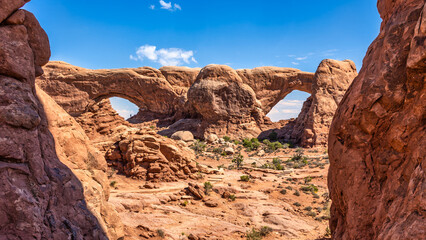 Fototapeta premium The Windows in Arches National Park, Utah. Also known as the Spectacles, these two arches stand side by side, cut from the same sandstone fin. A large nose separates the Spectacles