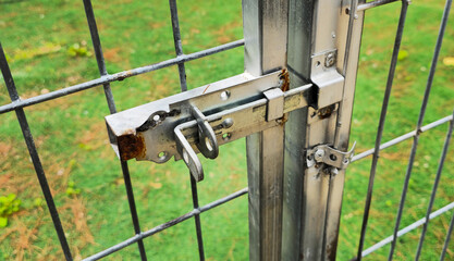 Iron lock, latch on the gate. 
Castle close up