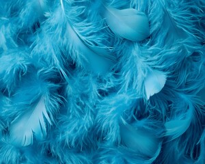 Obraz premium A close-up of soft, vibrant blue feathers creating a textured background.