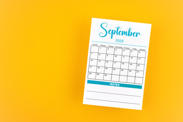 September 2025 calendar page on yellow background.
