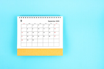 September 2025, Monthly desk calendar for 2025 year on blue background.