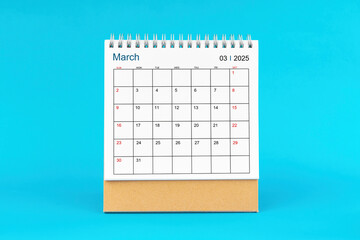 March 2025, Monthly desk calendar for 2025 year on Blue background.