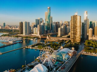 Chicago skyline at sunrise, showcasing the city's architecture and harbor. Aerial view of the city's waterfront. Navy Pier, Chicago, Illinois, United States Of America