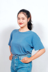 Portrait of a confident smiling girl standing on white background