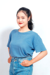 Portrait of a confident smiling girl standing on white background