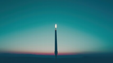 Fototapeta premium Elegant Candle Flame Against a Gradient Sky at Dusk