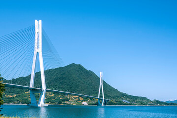 Obraz premium Tatara Bridge over the Shimanami Kaido and the blue sky