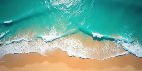 Fototapeta premium Aerial View of Turquoise Ocean Waves Crashing on Sandy Beach 