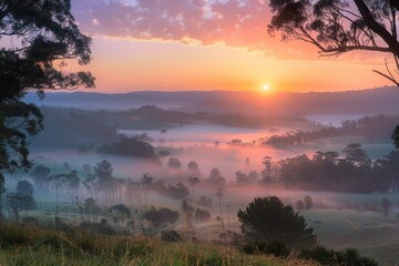 Stunning sunset over misty valley creating a serene atmosphere in a mountainous landscape during twilight hours