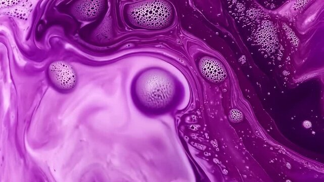 Colorful abstract art with swirling purple patterns and bubbles created using fluid paint techniques