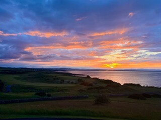Sunset over a golf course along the coast