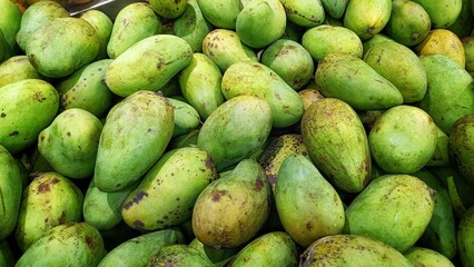 High Angle View Fresh green mangoes at a fruit stand