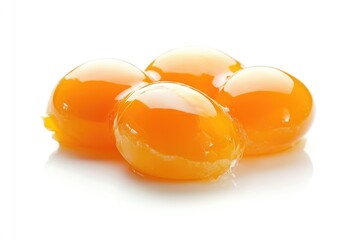 Four Golden Yellow Egg Yolks Isolated On White