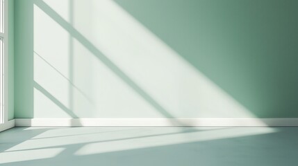 Natural light creates dynamic shadows on a pastel green wall during late afternoon in an empty room