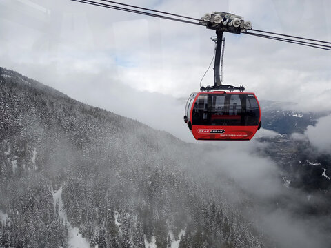 British Columbia, Whistler, Canada - Mar 16 2022: The Peak 2 Peak Gondola is a tricable gondola lift at Whistler Blackcomb Resort in Whistler, British Columbia, linking Whistler Mountain's Roundhouse