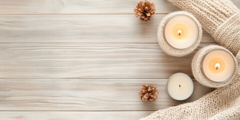 Cozy Winter Essentials Homemade Candles and Knitted Warmers on Rustic Wood