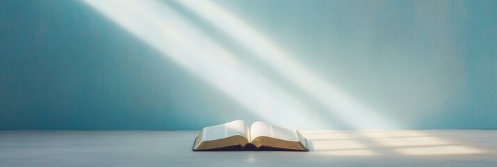 Open Bible Illuminated by Sunlight on Table - Tranquil Spiritual Scene