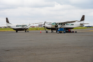 Airplanes on the tarmac at Nairobi-Wilson Airport, preparing for African wildlife adventure safari in Kenya
