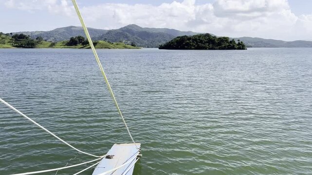 Excursion boat driving through the reservoir Presa de Hatillo near Cotui in the S&aacute;nchez Ram&iacute;rez province of the Dominican Republic