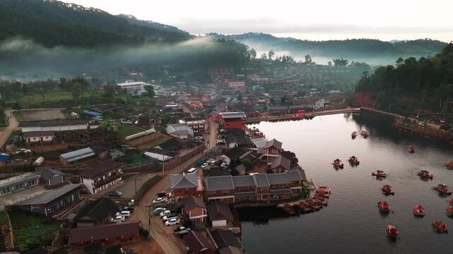 Sunset aerial landscape at Ban Rak Thail village Thailand, natural valley village scenario around Tropical Tea plantations lush greenery