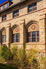 Fototapeta premium The building has a lot of windows and a lot of arches