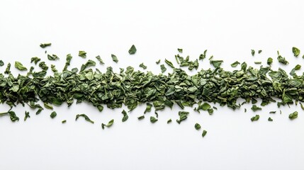 Loose green tea leaves scattered on white. Ideal for tea packaging, blogs, or websites focused on healthy drinks and well-being.