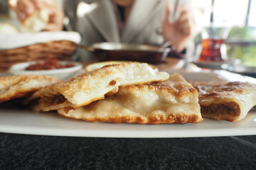 Close-Up of Crispy Pastries and Tea on a Dining Table