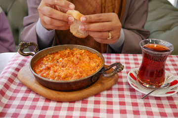 Turkish Menemen omelet in a frying pan. .
