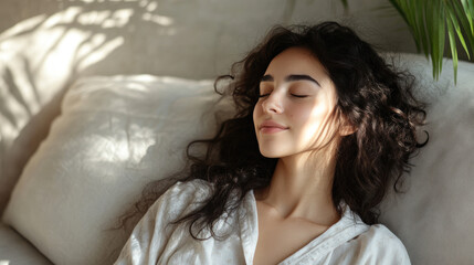 Arab woman in pajama sitting on comfort sofa with eyes closed and relaxing
