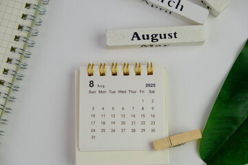 Monthly desk calendar of August 2025 on an white isolated background. 