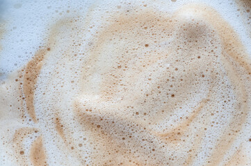 Coffee foam texture with latte microfoam swirl