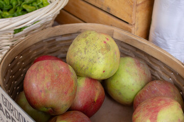 A view of a basket full of Gordon apples, on display at a local farmers market.