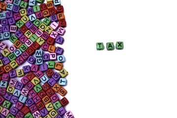 Colorful Alphabet Blocks Spelling 'Tax' on a White Background Surrounded by Letters