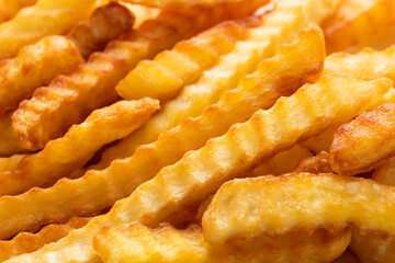 Heap Of Crinkle Cut French Fries. Close-up