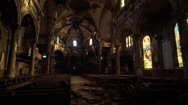 Broken Pew Chairs Inside The Abandoned Church Of Saint Eusebe de Verceil Due To Fire In Montreal, Canada. - handheld shot