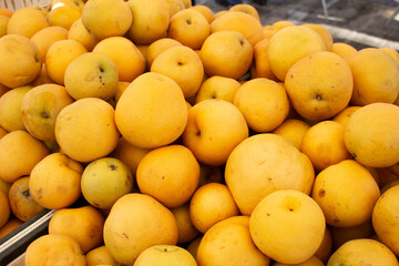 A view of a pile of Asian pears, on display at a local farmers market.