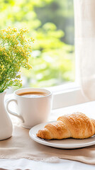 cozy morning scene with coffee and croissant by window