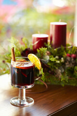 Warm wine with lemon in a cup