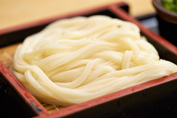 Boiled udon noodles in a bowl
