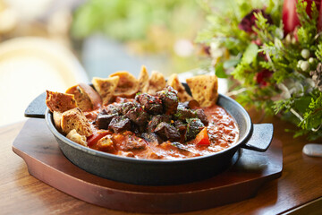 Steak with sauce in a cast iron pan