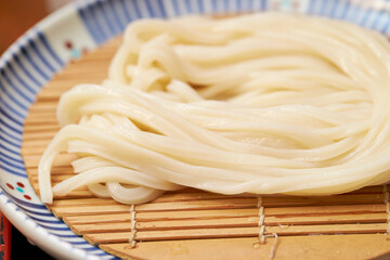 Boiled udon noodles in a bowl