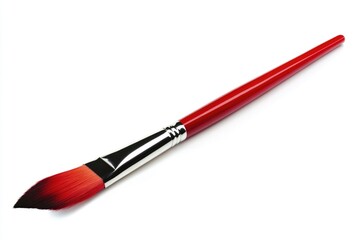Fototapeta premium A single red handled paintbrush lies on a white background