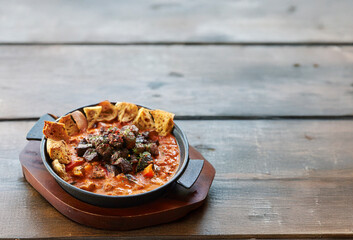 Steak with sauce in a cast iron pan