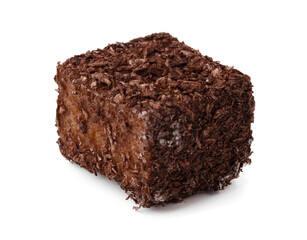 Chocolate square coated with coconut flakes sits on a white surface ready to be enjoyed as a sweet treat or dessert